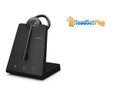 Jabra wireless headset in its ear-hook wearing style, docked on the charging base