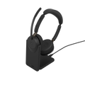 Stereo Jabra headset resting on its powered charging stand with the boom mic raised